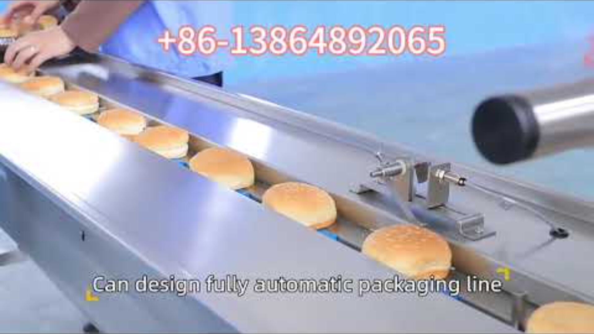 Conveyor belt with hamburger buns being inspected and packaged in a factory; workers hands are visible, and text reads +86-13864892065 and Can design fully automatic packaging line.