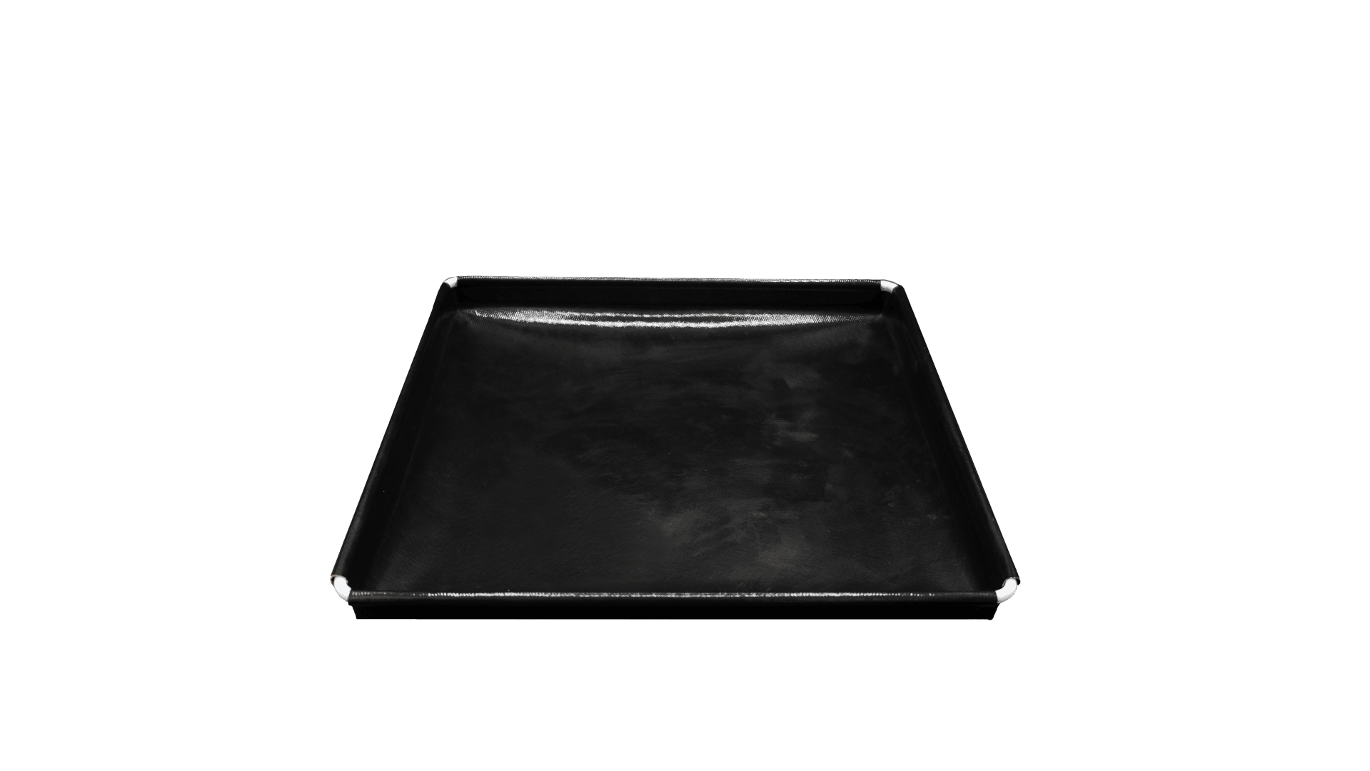 A black rectangular tray with a slightly raised edge, photographed against a green background. The surface of the tray appears smooth and slightly shiny.