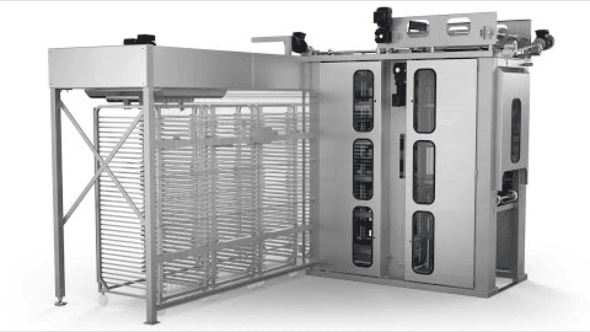 Industrial stainless steel food processing machine with vertical racks and enclosed compartments, featuring transparent windows and visible wiring, designed for automated handling or storage in a commercial setting.