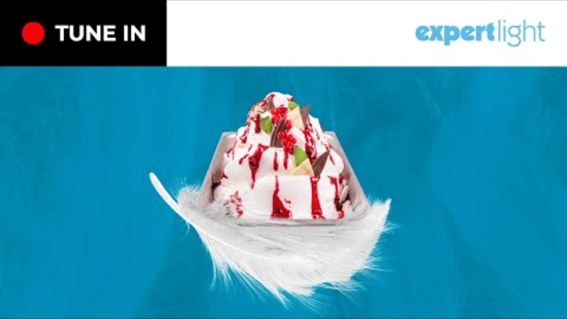 A dessert with whipped cream, red syrup, and small toppings sits in a bowl on a white feather. The background is blue, with TUNE IN and bright expert text in the upper corners.