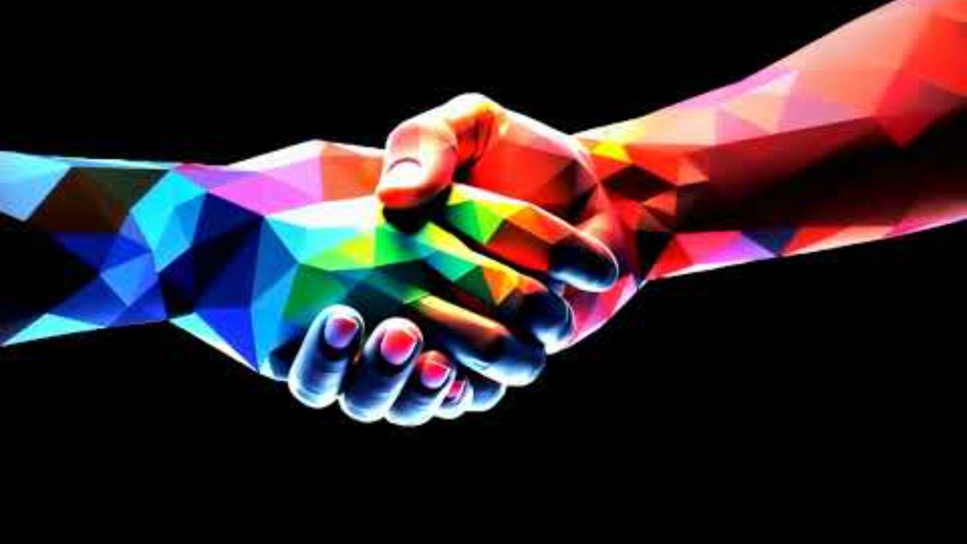 Two hands with a geometric, multicolored pattern shake hands against a black background, symbolizing unity, diversity, and cooperation.