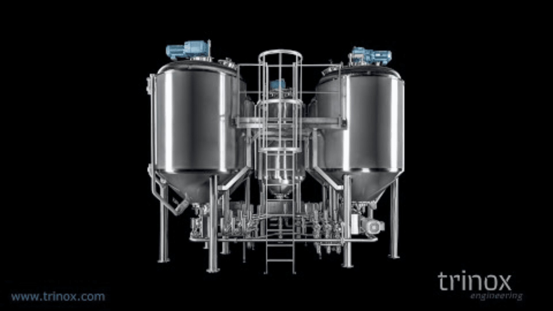 A stainless steel industrial brewing system with two large vertical tanks, blue motors on top, and connecting pipes, displayed against a black background. “trinox engineering” logo appears in the lower right corner.