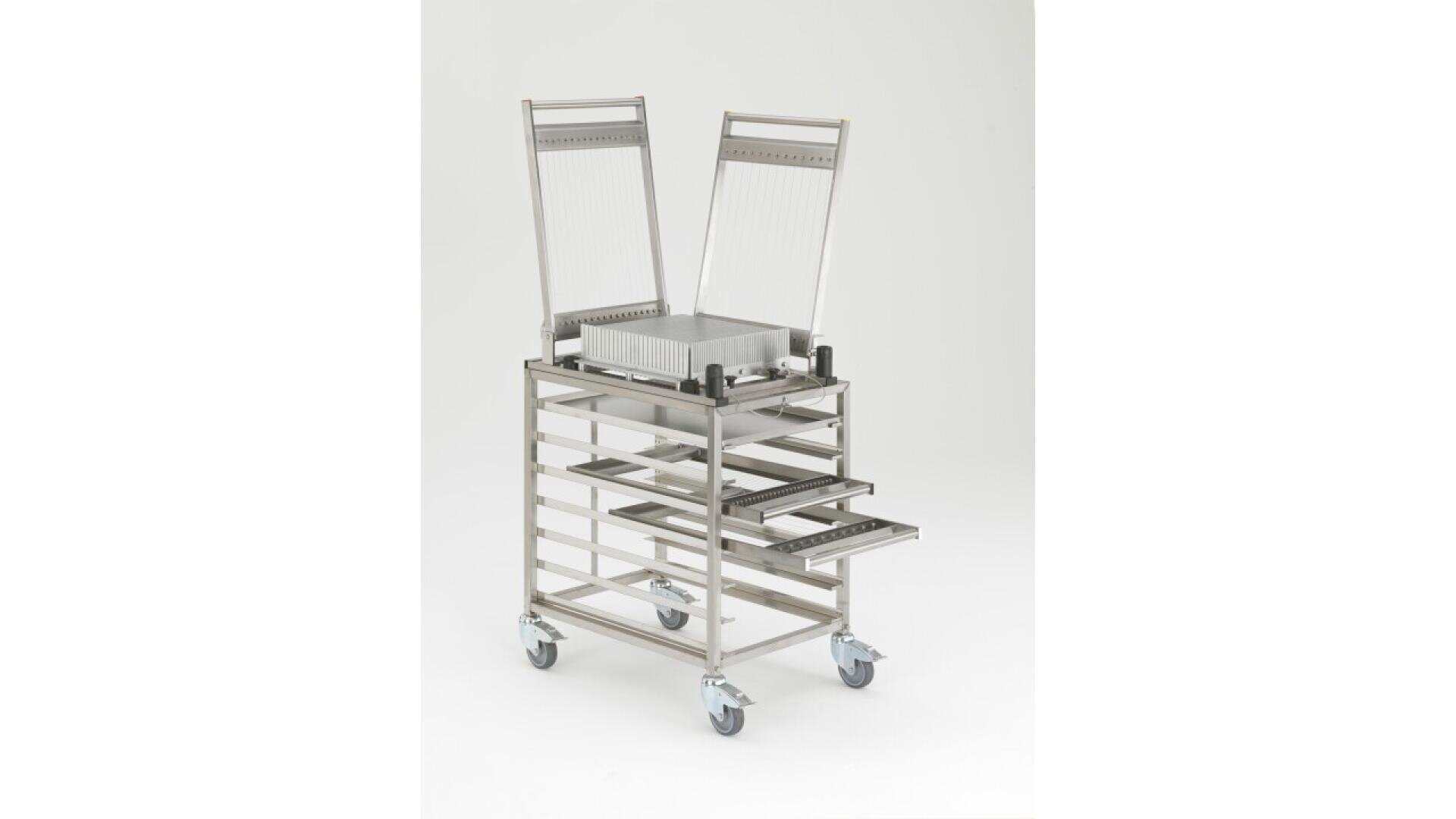 A metal cart with four wheels, multiple horizontal slots, and two vertical frames positioned on top. Several trays are partially pulled out from the middle. The cart is set against a plain white background.