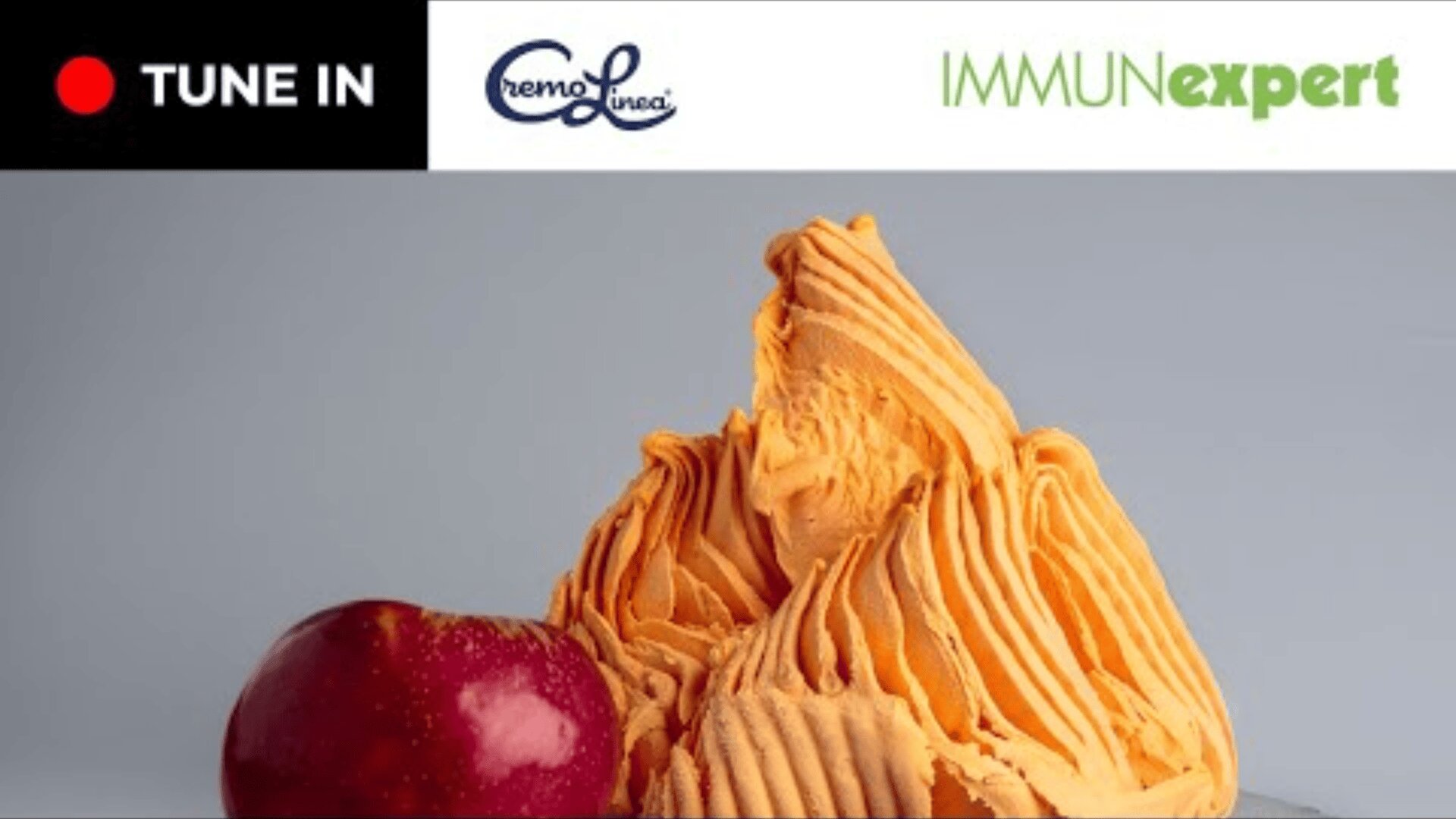 Orange ice cream in a swirl next to a red apple. At the top are the logos of TUNE IN, CremoLinea, and IMMU Nexpert on a white background.