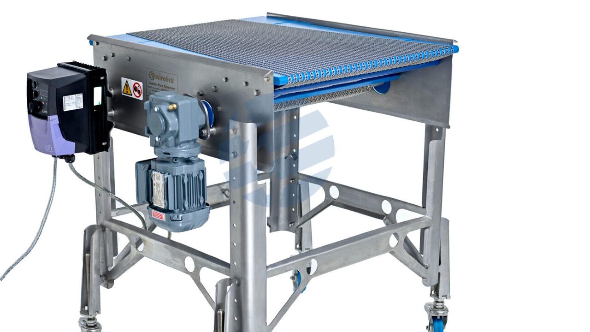 A stainless steel conveyor system with a mesh belt, motor, control box, and wheeled legs, designed for industrial material handling.
