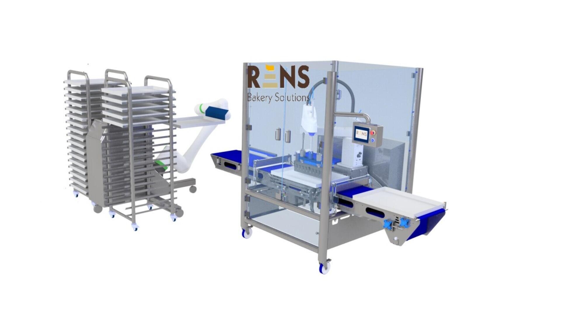A commercial bakery machine by RENS Bakery Solutions stands next to racks stacked with baking trays. The machine appears automated with conveyor belts for efficient bakery production.