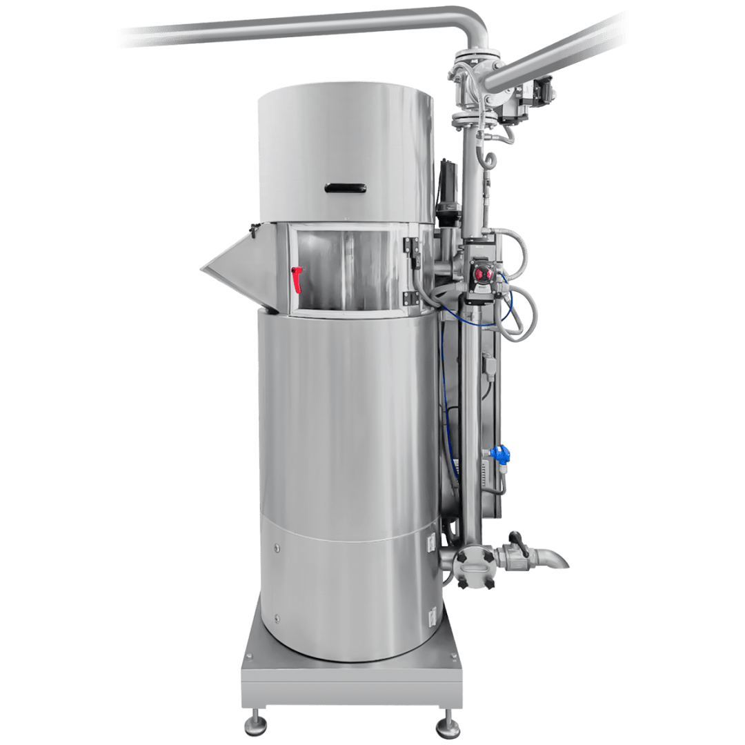 A large, cylindrical stainless steel industrial machine with attached pipes, control components, and a small viewing window, designed for food or chemical processing. The machine stands on four legs.