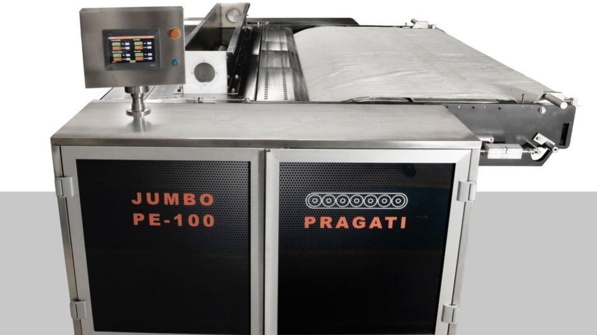 A large industrial machine labeled JUMBO PE-100 and PRAGATI, featuring a control panel with a screen, metallic body, and conveyor belt, designed for processing materials or products.