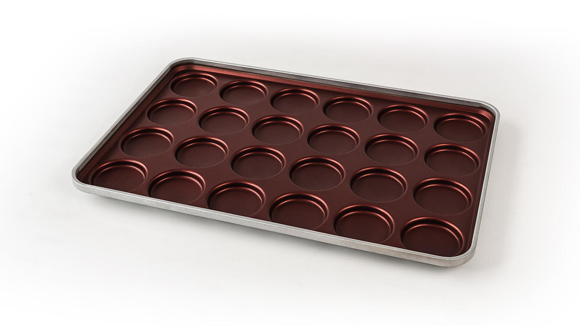 A metal baking tray with 24 round, shallow molds arranged in a grid, designed for making small baked goods like muffins or tarts, on a white background.