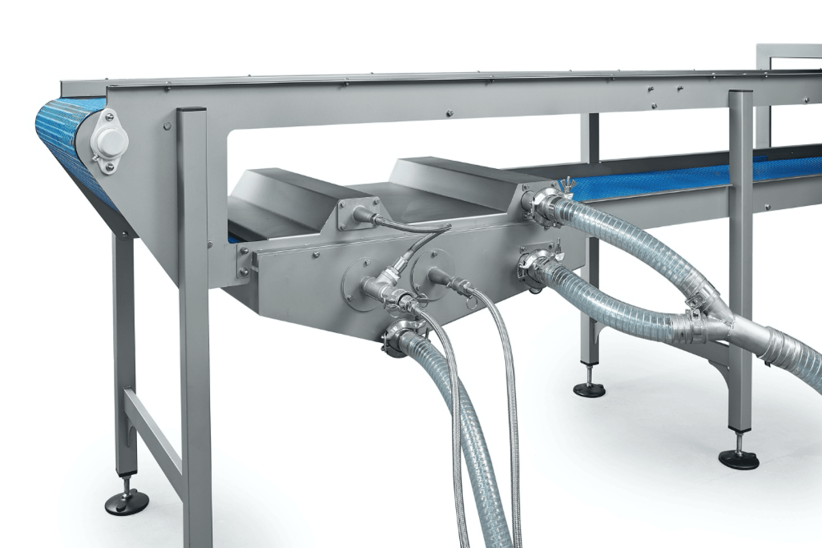A stainless steel industrial conveyor system with a blue belt, multiple metal tubes, and flexible hoses connected to it, used for processing or transporting materials in a manufacturing facility.