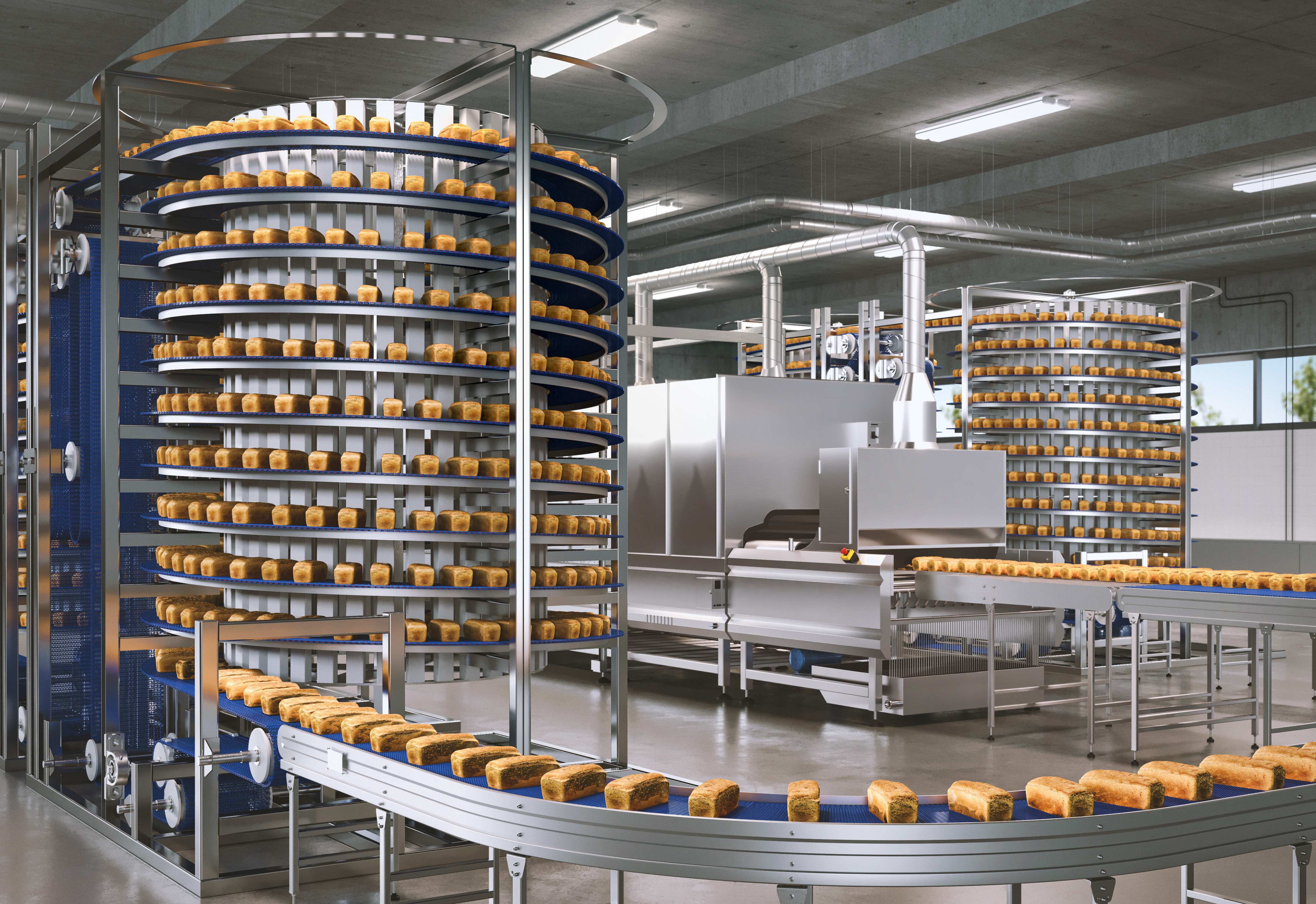 A large industrial bakery with spiral conveyor belts transporting loaves of bread. Machinery and equipment automate the bread production process in a modern, well-lit factory environment.