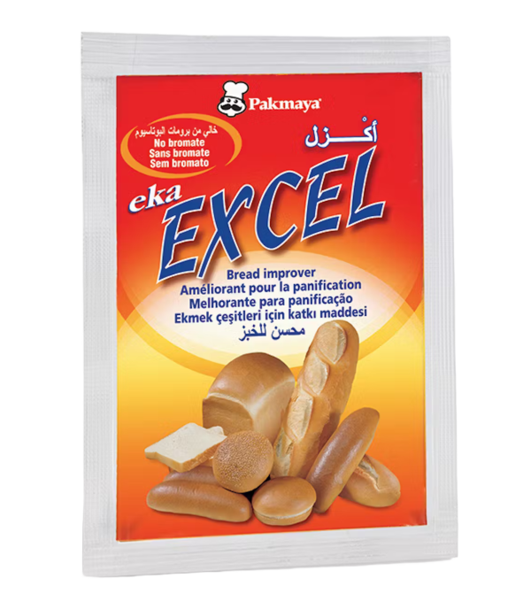 A packet of Pakmaya Eka Excel bread improver with images of assorted bread and rolls, featuring text in multiple languages and a red-and-yellow background.